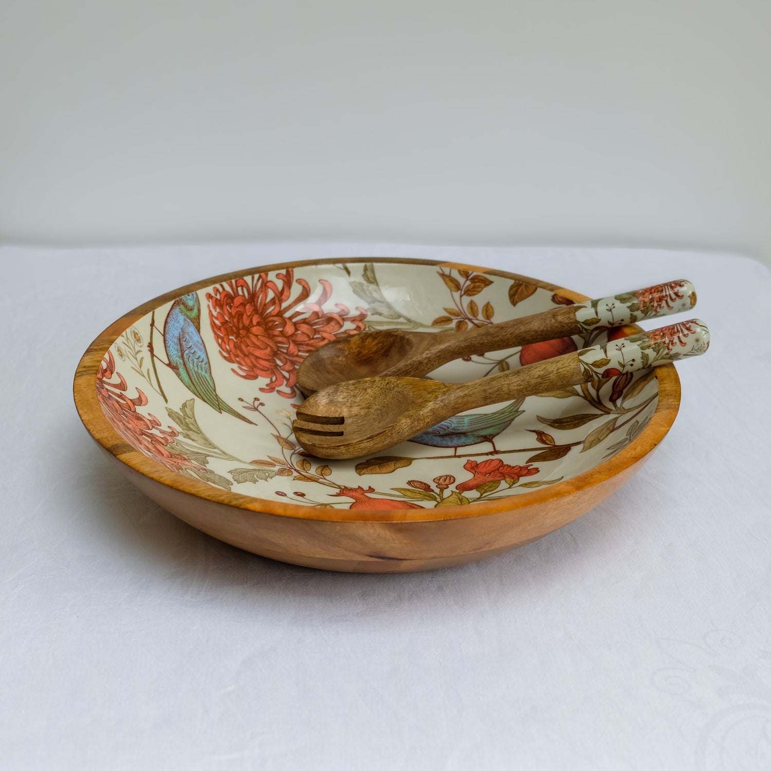 Large statement bowl (38cm) with a William Morris inspired orange bird design. Made with sustainable mango wood. Suitable as a fruit bowl or salad bowl.  With matching salad servers.